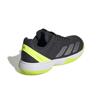 Black and yellow tennis shoe with Adidas logo on a white background