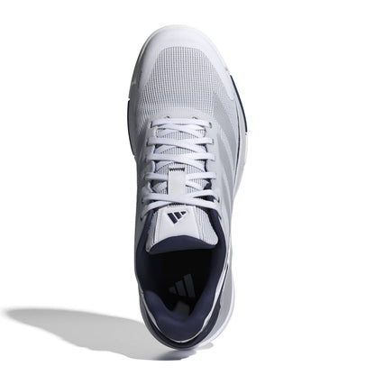 A single Adidas padel shoe shown from a top-down view on a white background with a soft shadow. The shoe is primarily white with a dark navy blue collar and tongue label.