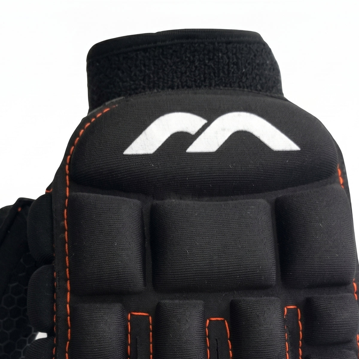 Black Mercian glove with orange stitching on a white background