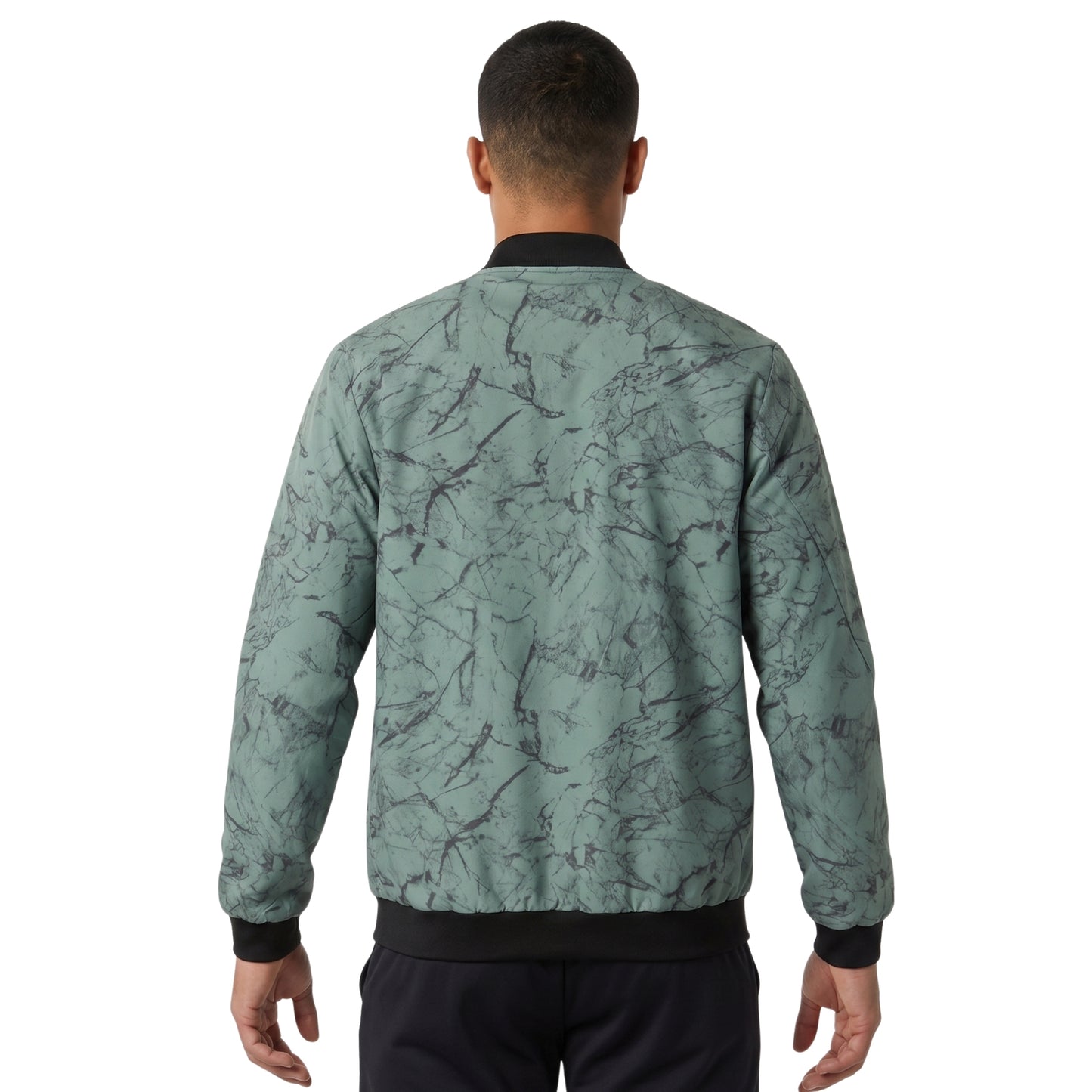Person wearing a green jacket on a white background