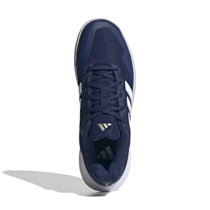 Navy blue tennis shoe with white accents on a white background