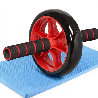 Black CHS Abdominal wheel with red accents on a blue mat on a white background