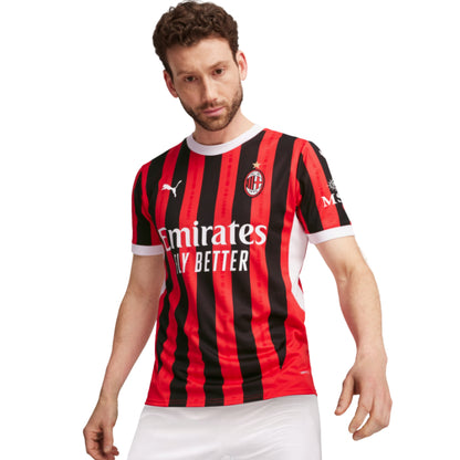 Person wearing a red and black striped sports jersey with visible Puma branding on a white background