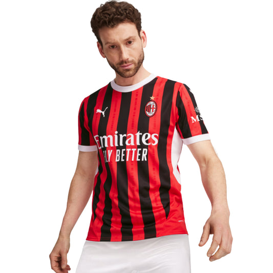 Person wearing a red and black striped sports jersey with visible Puma branding on a white background