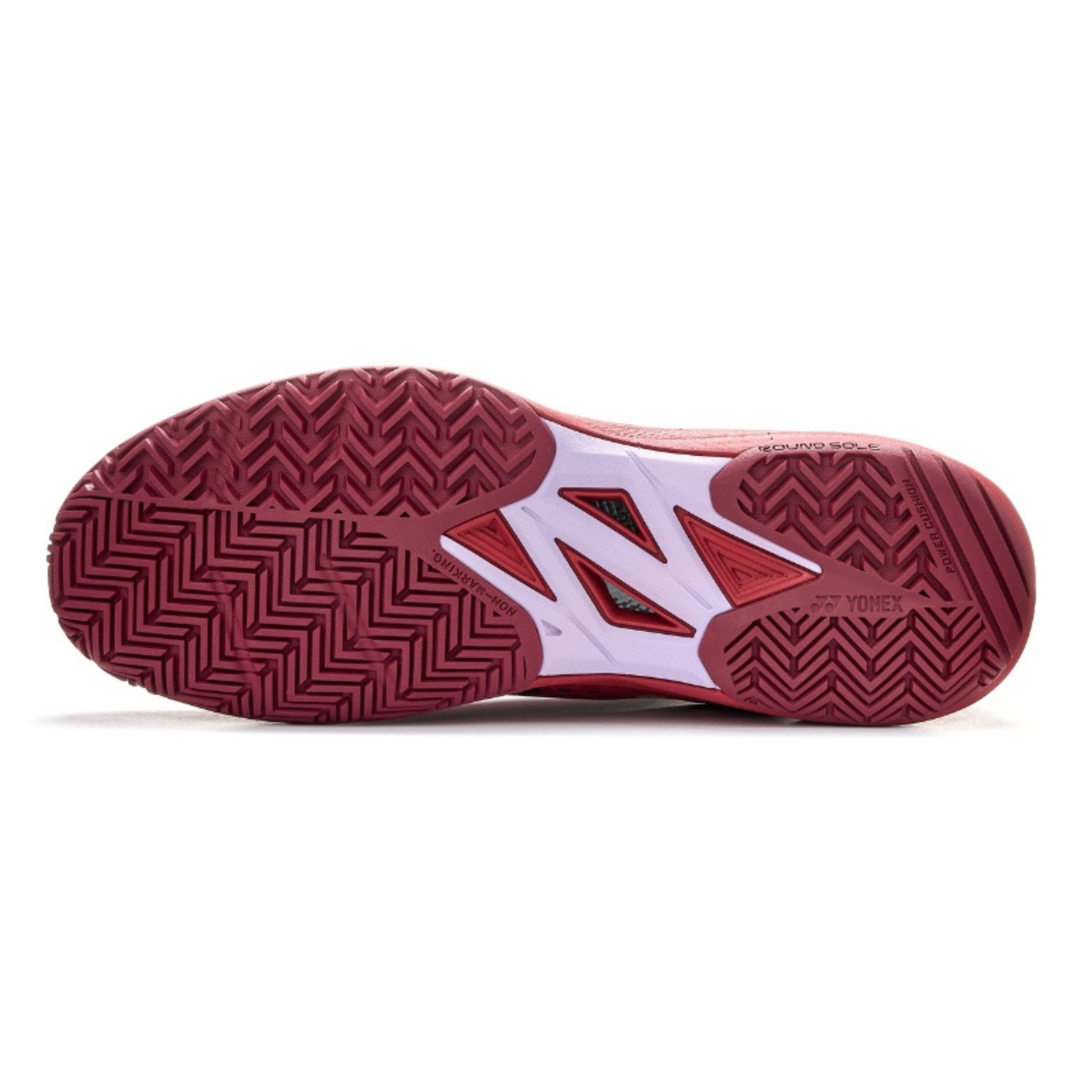 Red Yonex tennis shoe sole with brand logo on a white background
