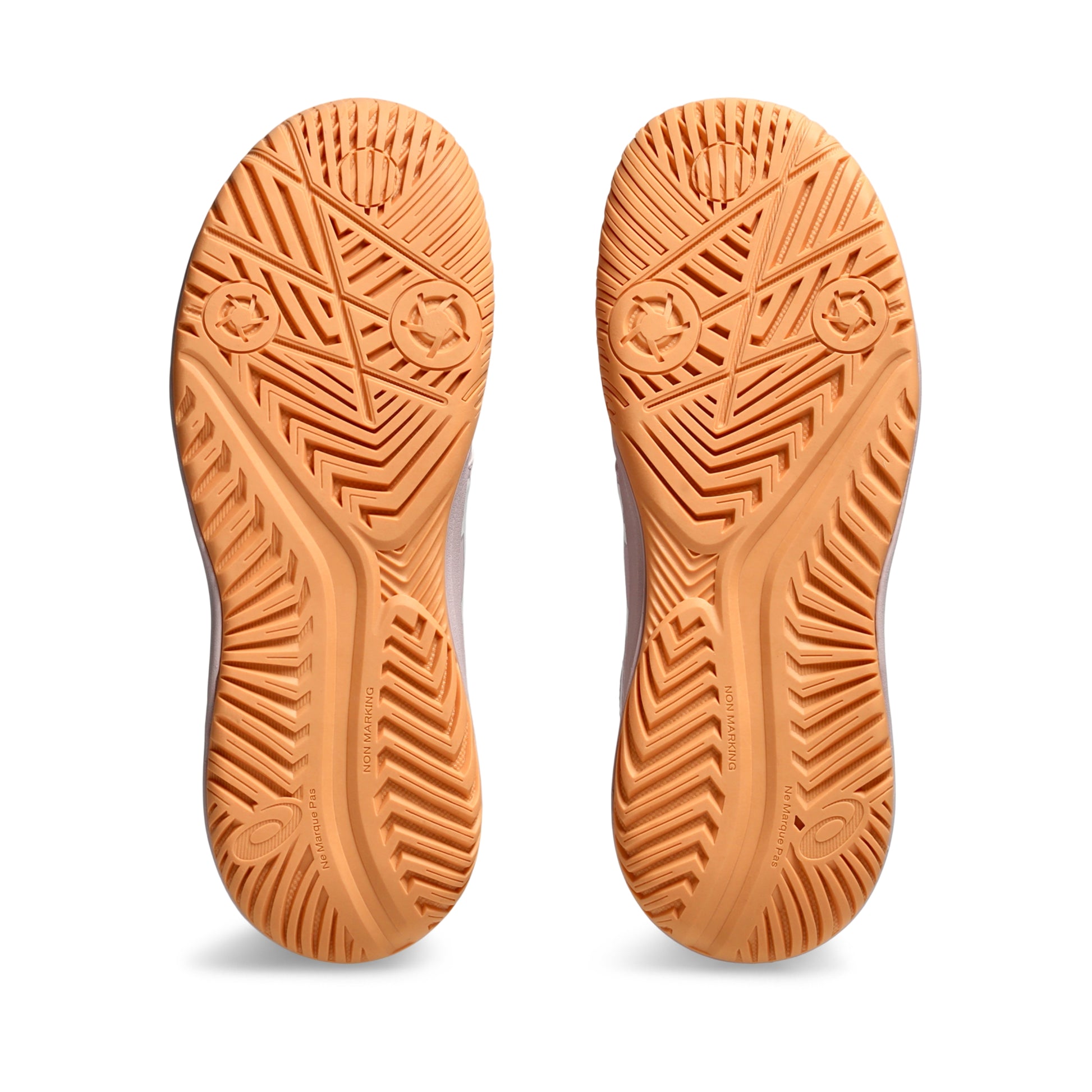 Close-up of orange Asics shoe soles with tread pattern on a white background