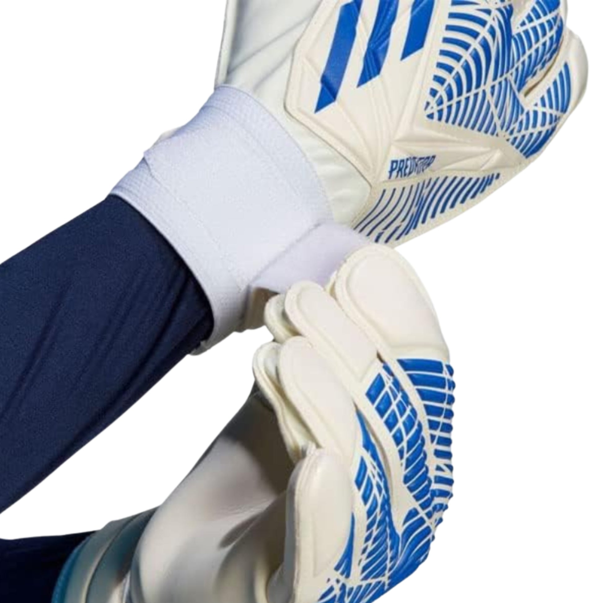 Close-up of a person wearing white goalkeeper gloves with blue patterns on a white background