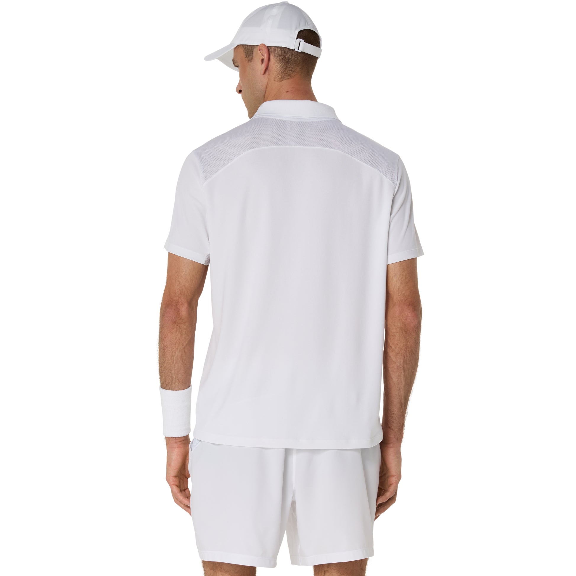 Man wearing a white polo shirt and shorts set with a white cap on a white background