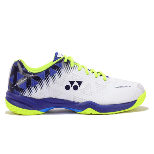 White Yonex squash shoe with blue and green accents on a white background