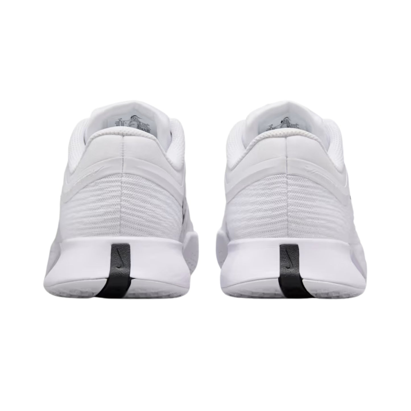 White tennis shoes with black accents on a white background