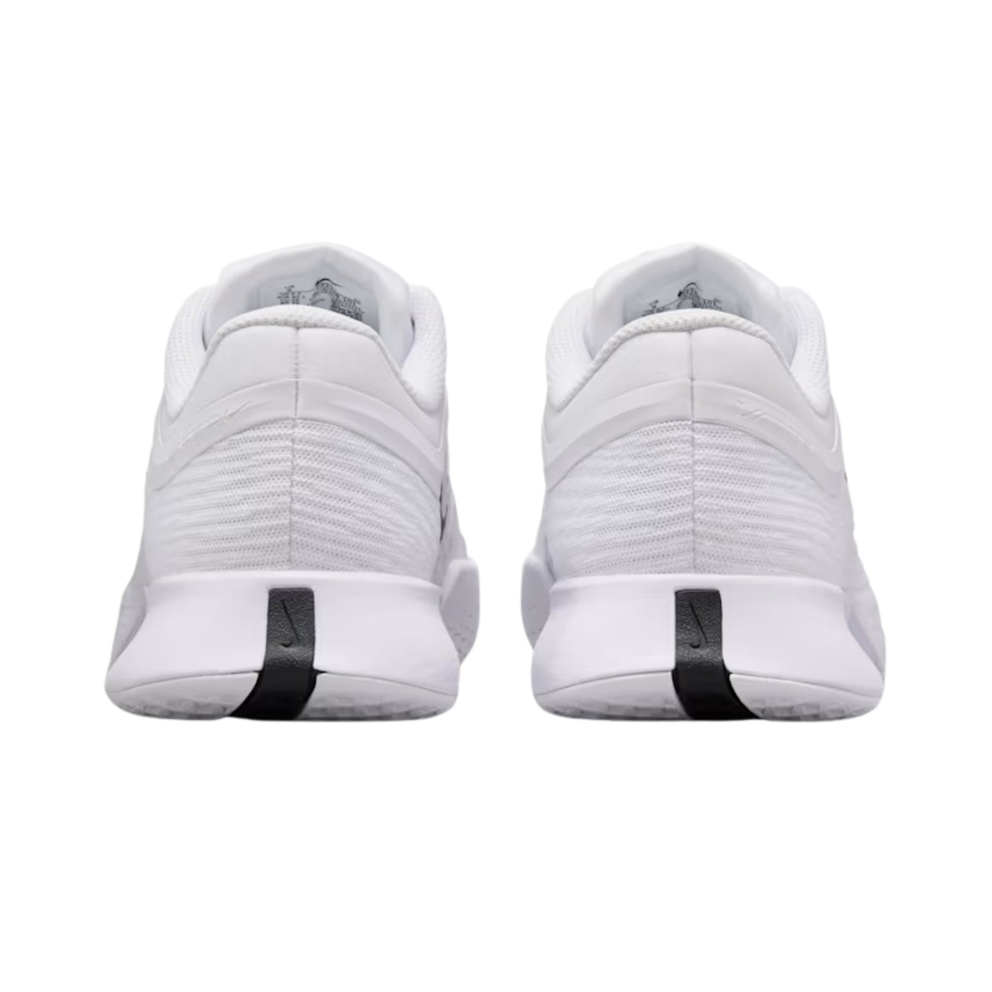 White tennis shoes with black accents on a white background