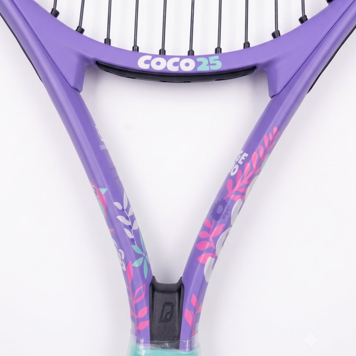 Close-up of a purple Head Coco 25 tennis racket with floral accents in pink, teal, and white, featuring black strings and a black grip cap on a white background.