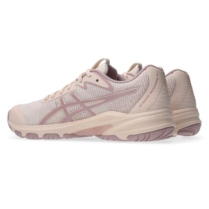 Pair of light pink netball shoes with a subtle pattern on a white background