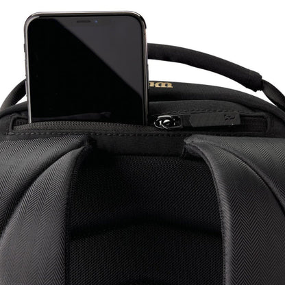 Black backpack with a smartphone inside the front pocket on a white background