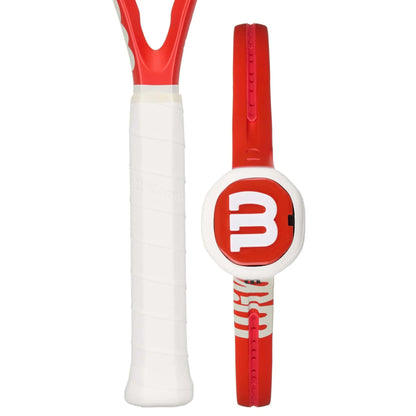 Red and white tennis racket with a visible brand logo on a white background
