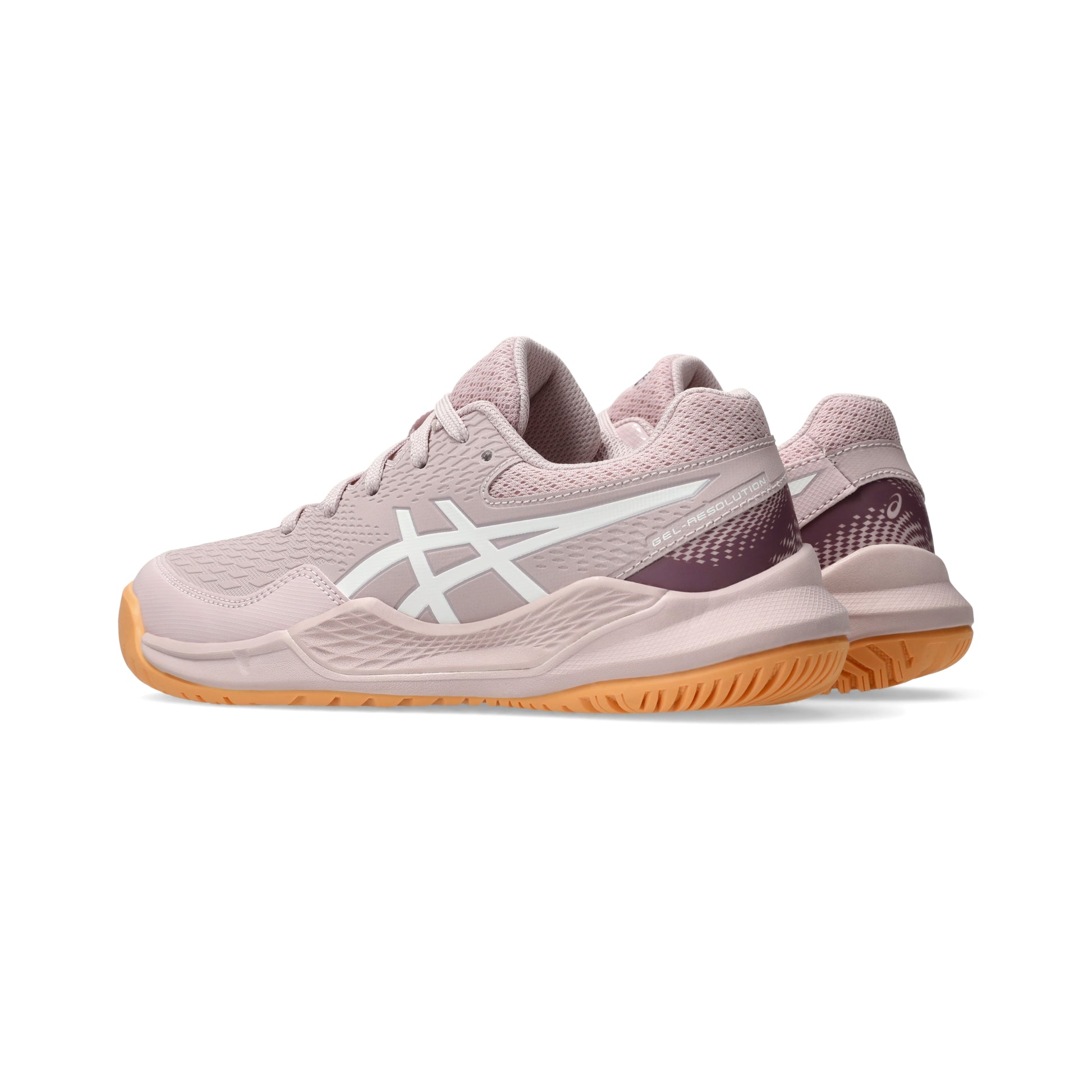 Pink Asics tennis shoes with orange soles on a white background