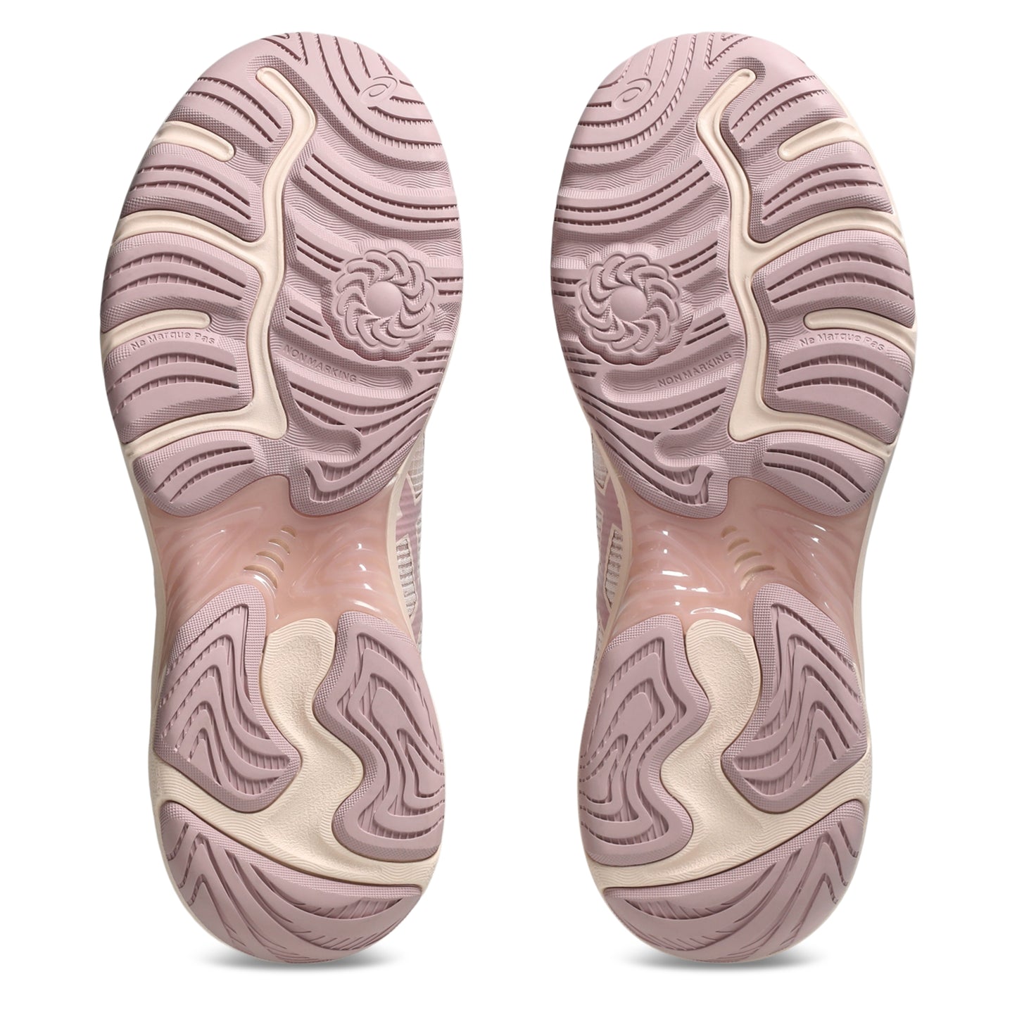 Pink and beige shoe soles on a white background