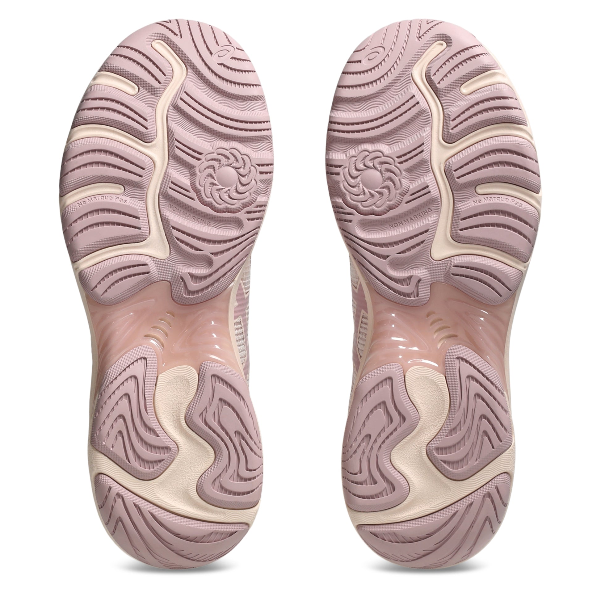 Pink and beige shoe soles on a white background