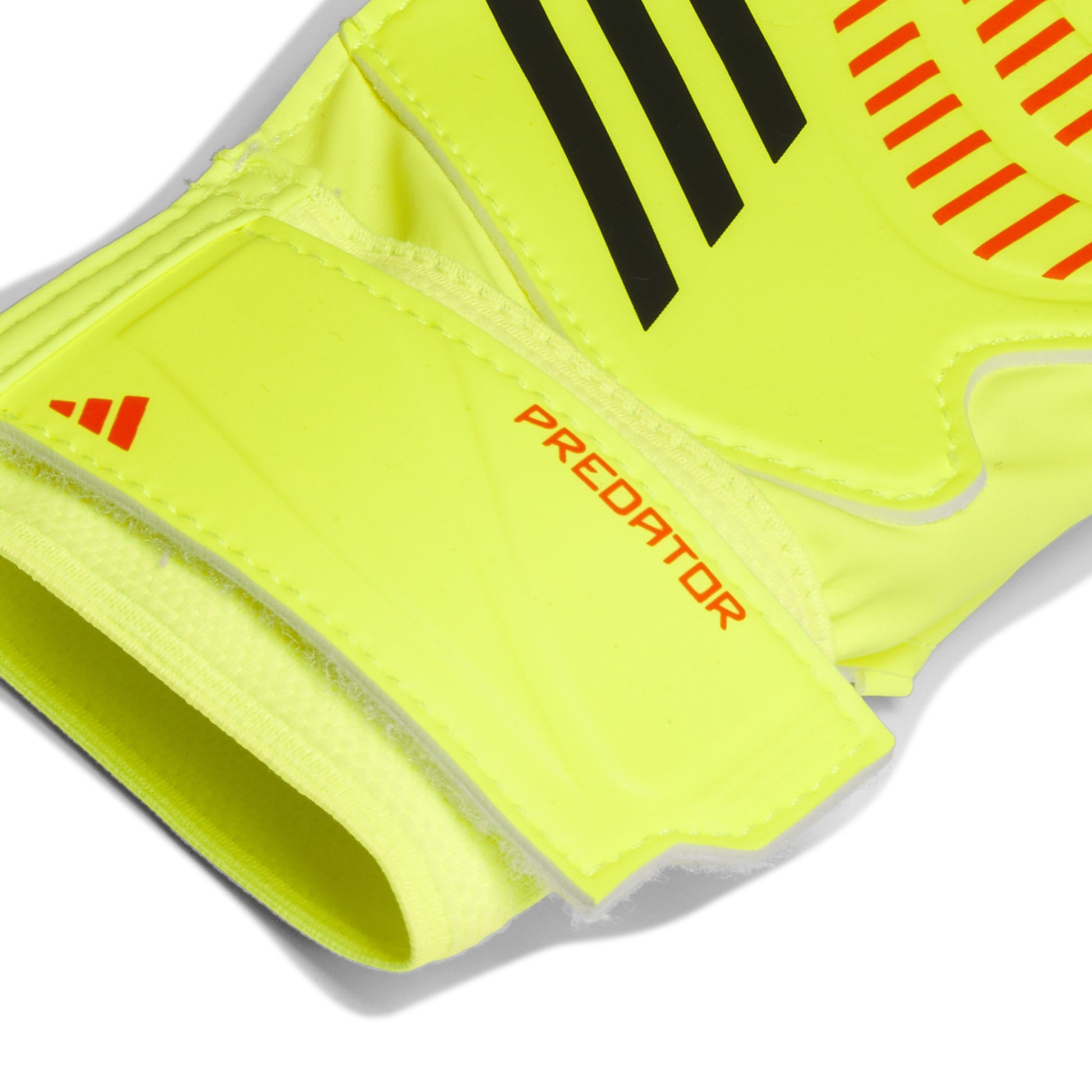 Yellow soccer glove with Adidas logo and 'Predator' text on a white background