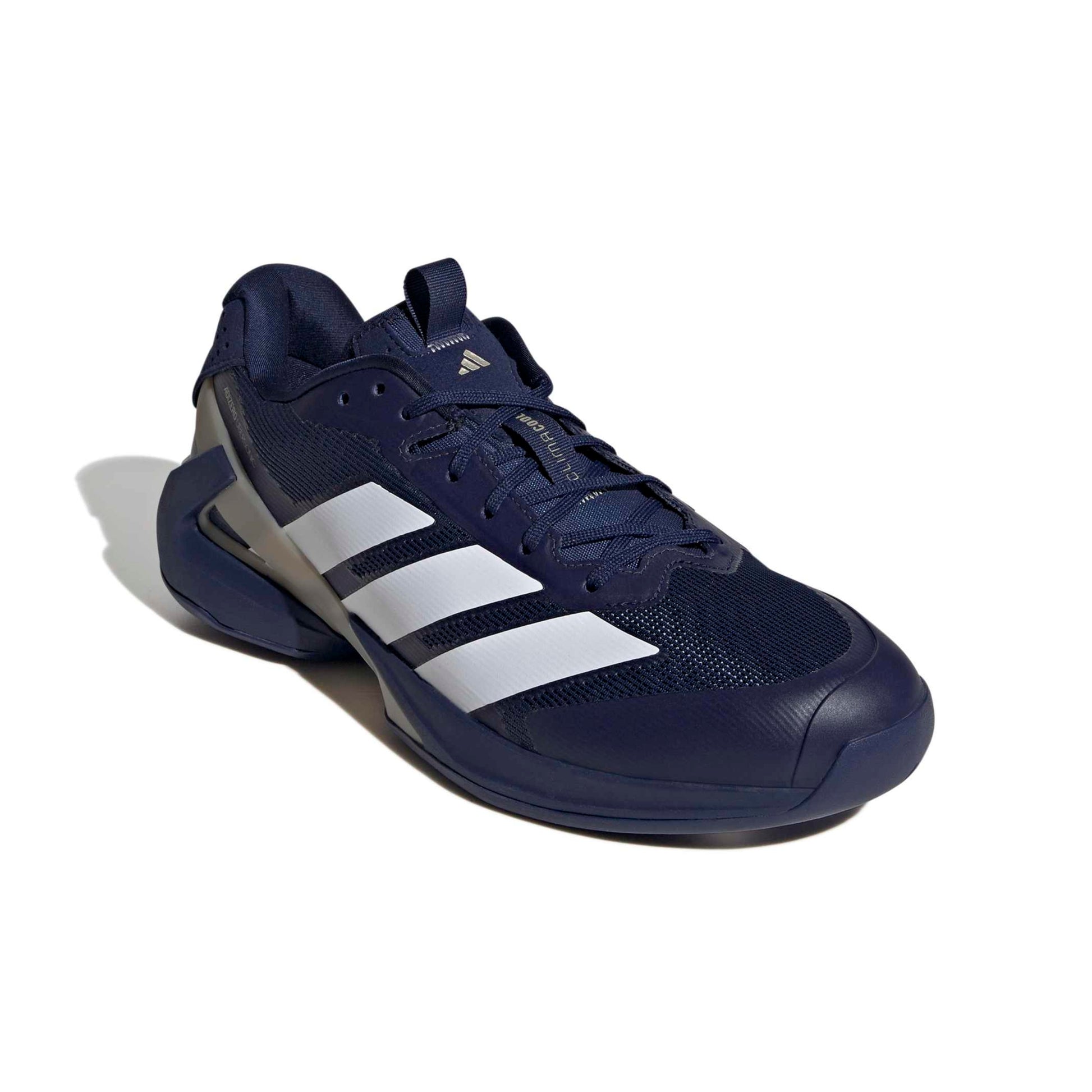 Navy blue and white Adidas tennis shoe on a white background