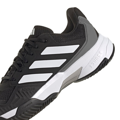 A black and white Adidas tennis shoe with three white stripes on the side, black laces, and a white and gray midsole, shown against a plain white background.