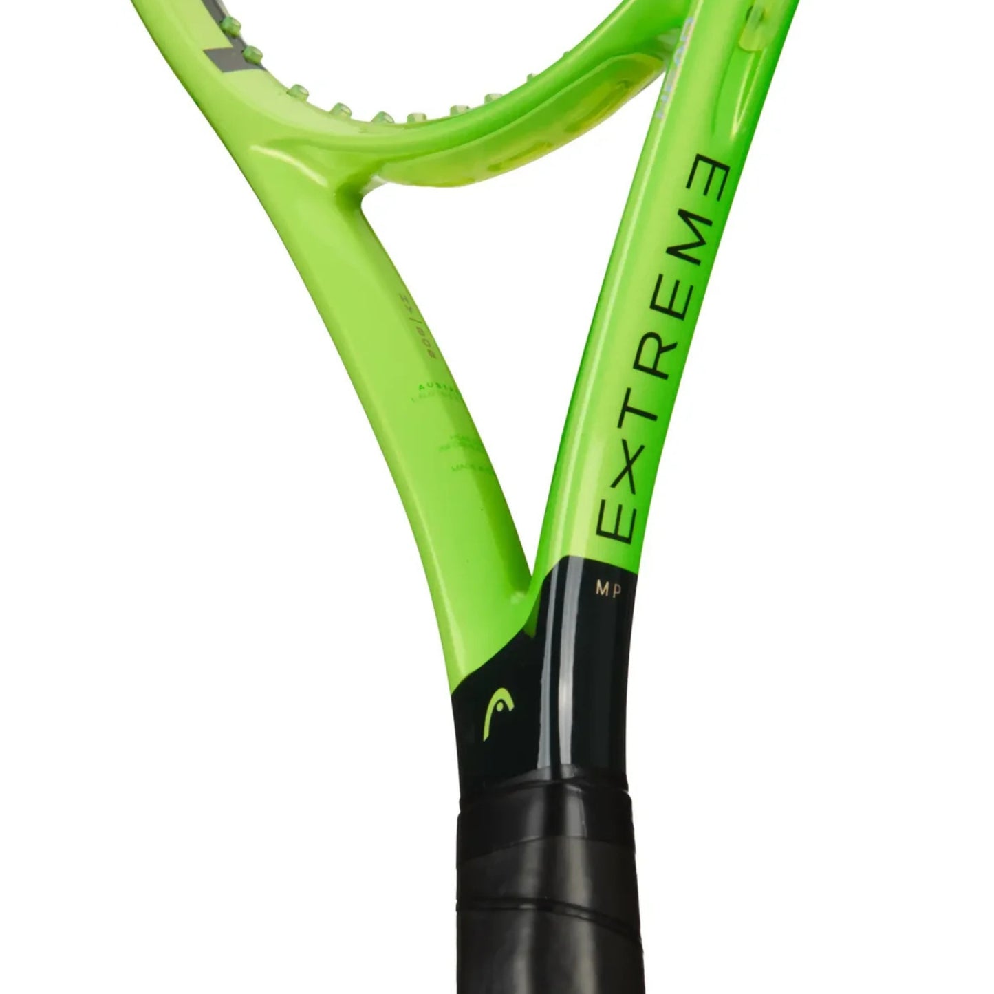 Close-up of a Head tennis racket frame in bright lime green with black grip and black printed 'EXTREME' branding, shown on a white background.