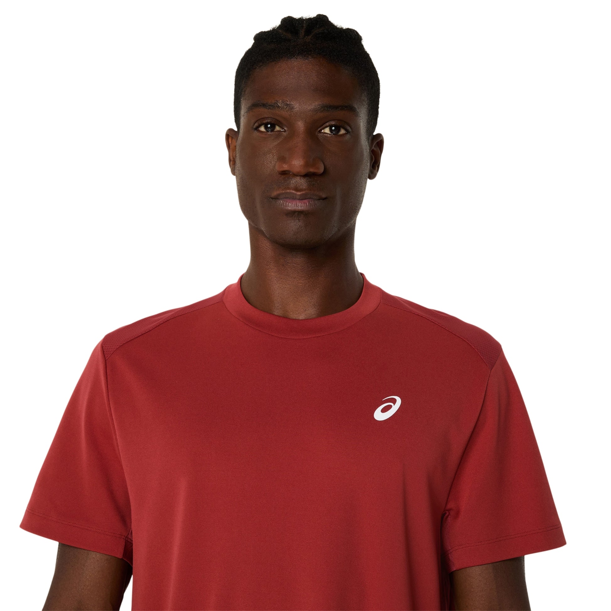 A man wearing a red short-sleeve athletic t-shirt with a small white Asics logo on the left chest, photographed against a solid white background.