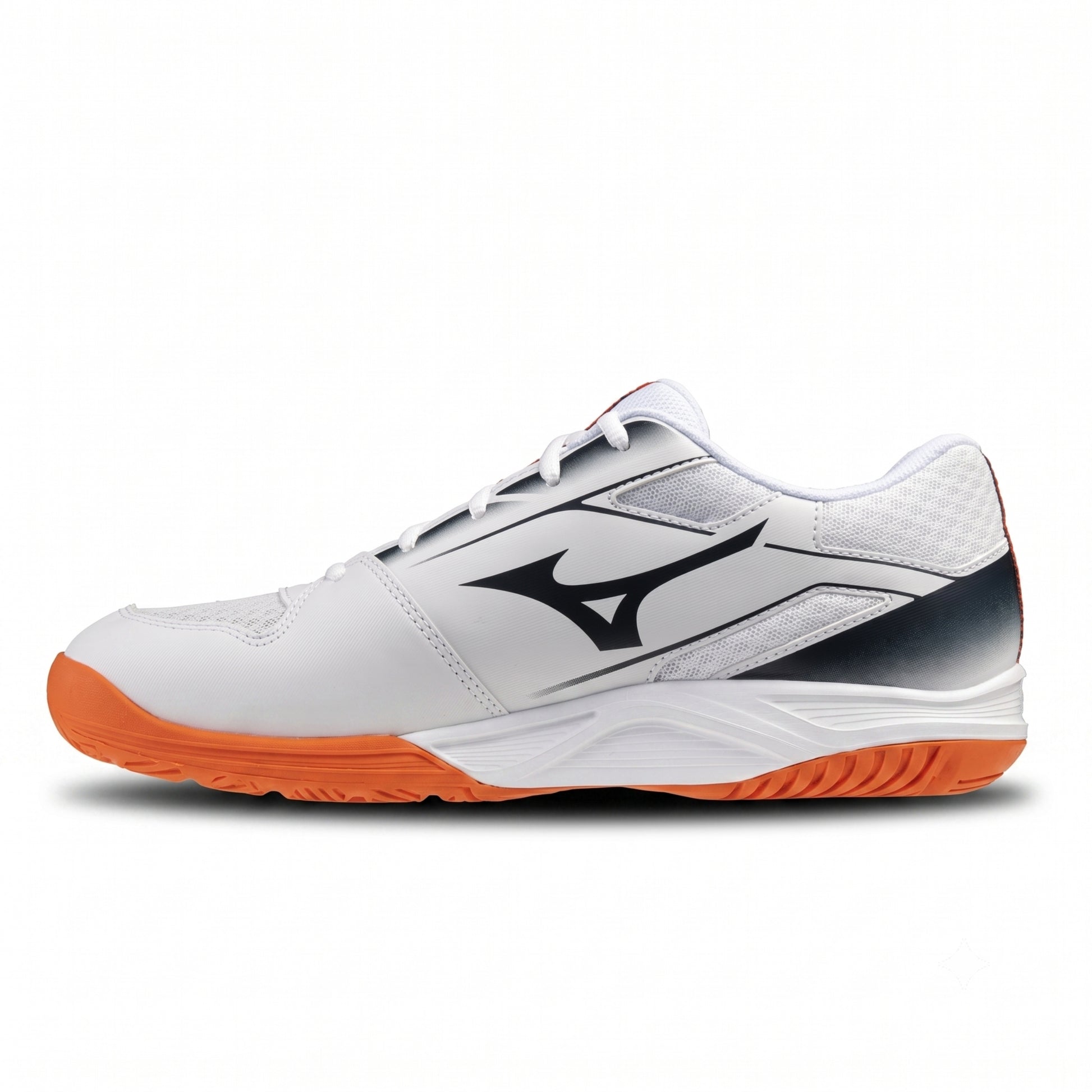 A white Mizuno squash shoe with a black logo, a dark gray heel accent, and an orange outsole, shown in a side profile on a white background.