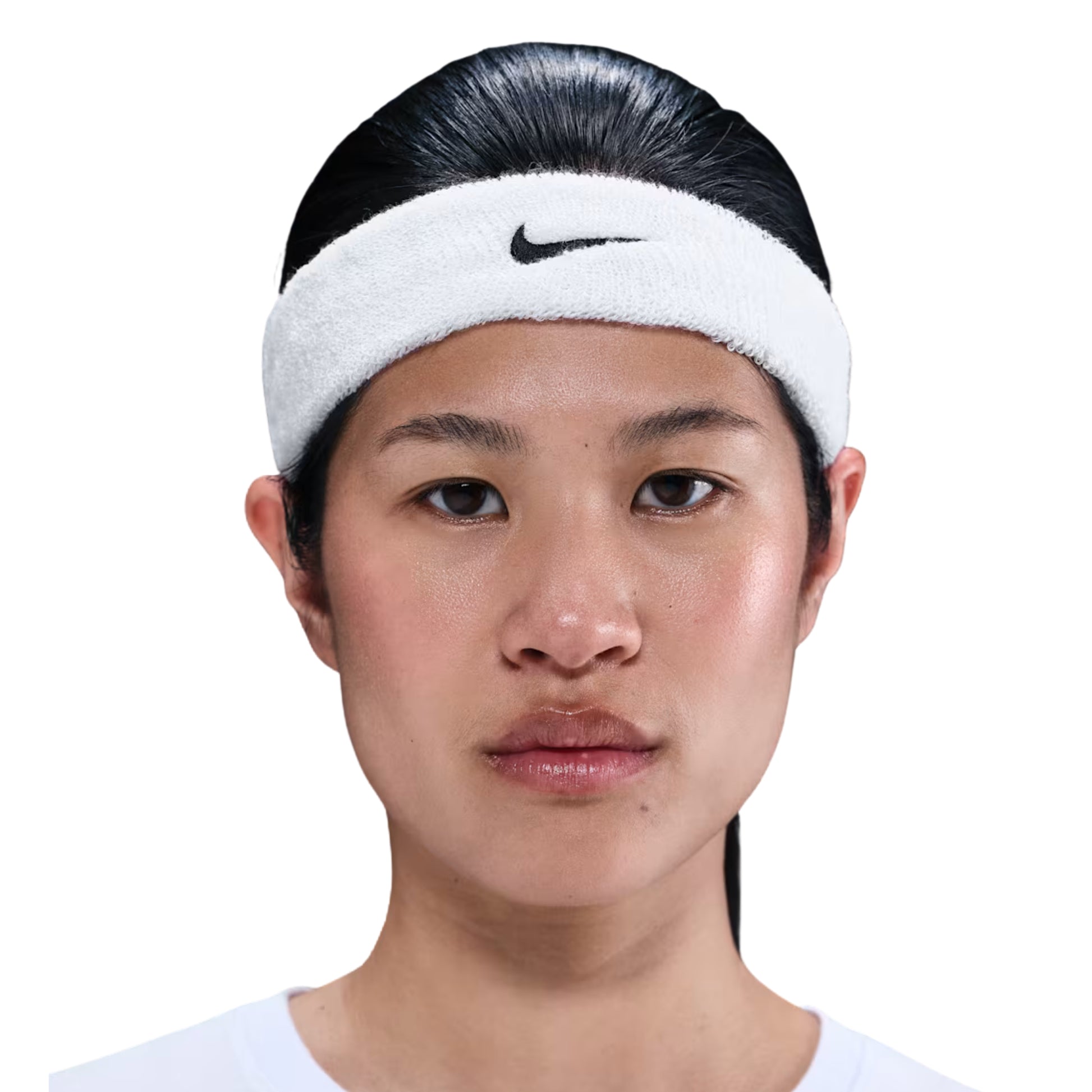 Person wearing a white Nike headband on a white background