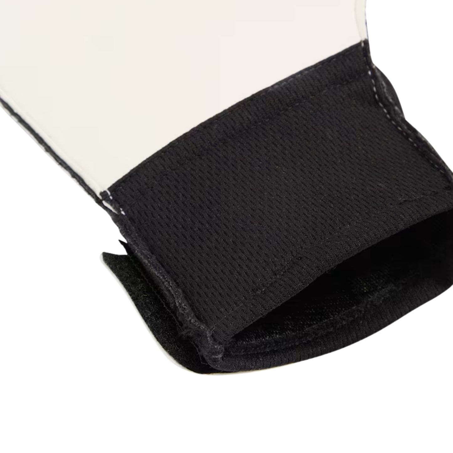 Close-up of a black strap of a Puma glove on a white background