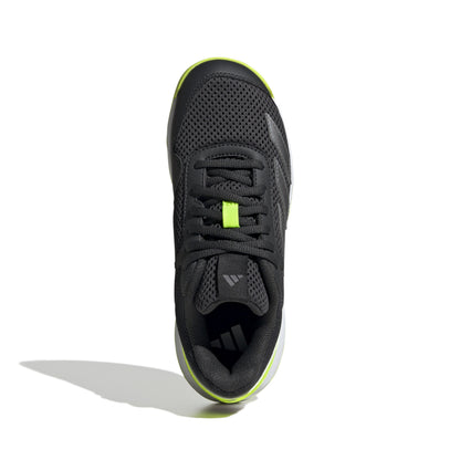 Black Adidas tennis shoe with green accents on a white background