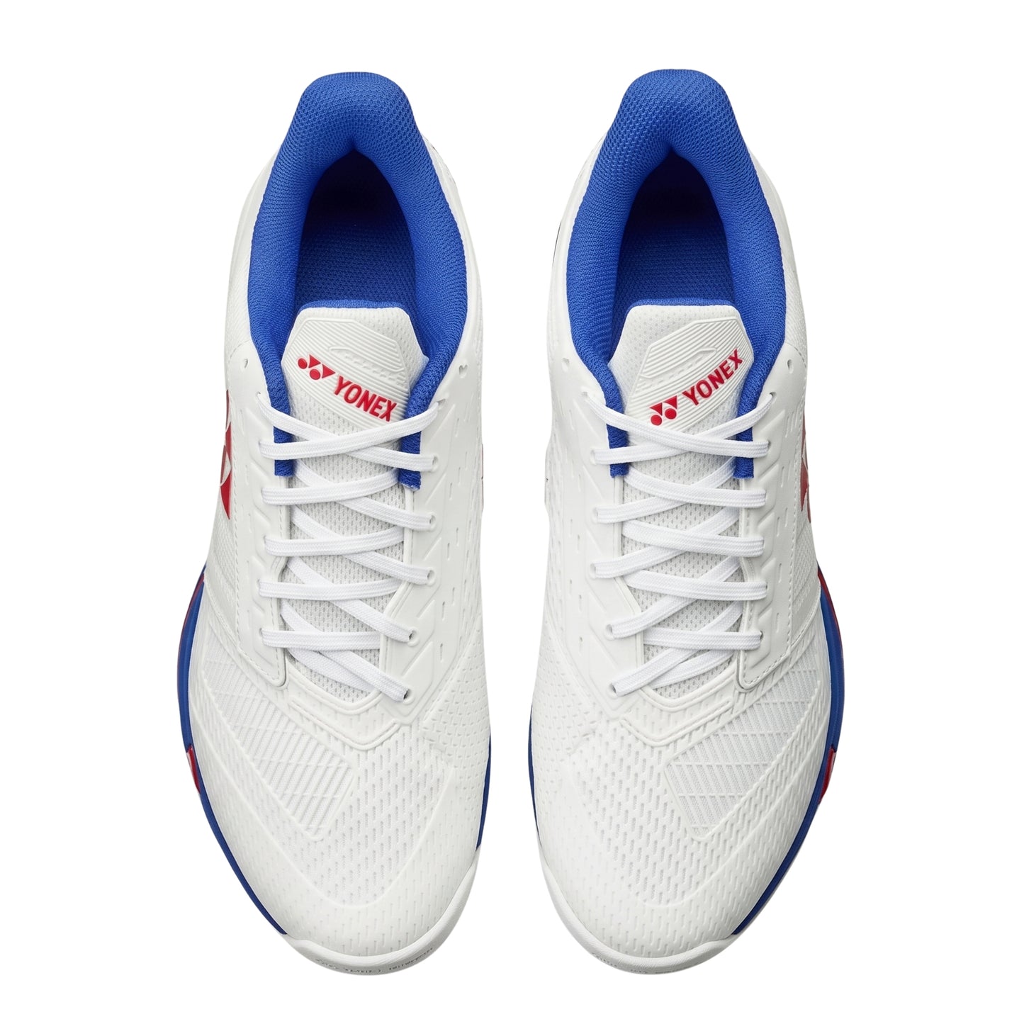 White tennis with blue soles and Yonex logo on a white background
