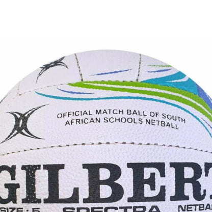 Close-up of a Gilbert Spectra netball with branding and text on a white background