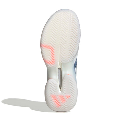 Close-up of a white adidas tennis shoe sole with pink accents on a white background