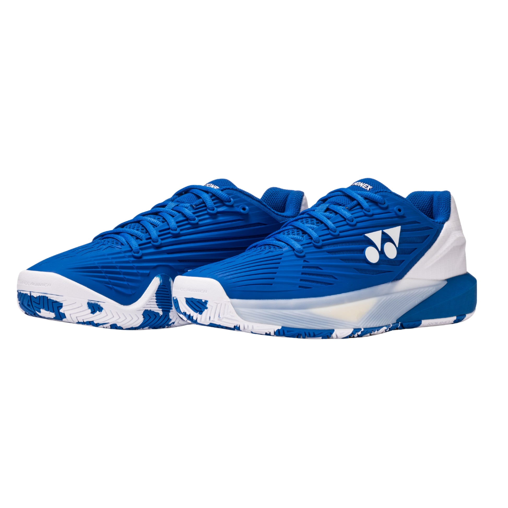 Pair of blue Yonex tennis shoes on a white background