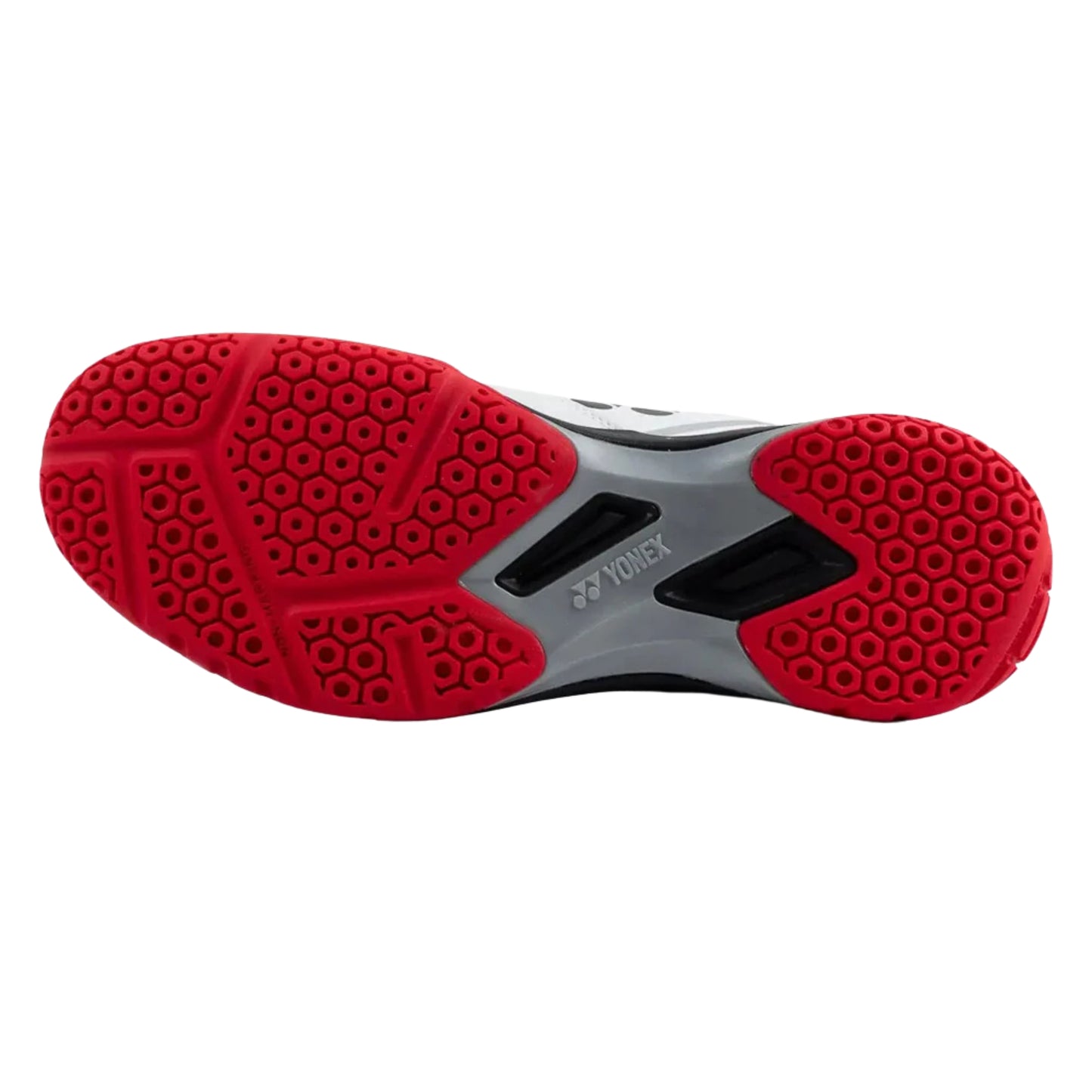 Yonex athletic shoe sole with red tread pattern on a white background