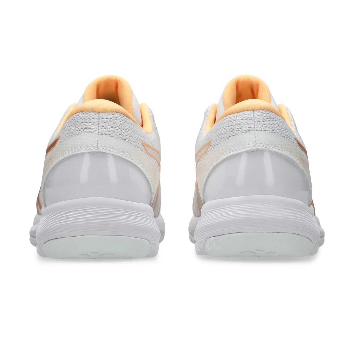 A pair of white netball shoes shown from the back, featuring light peach-orange lining and subtle orange accents on the heel straps, set against a plain white background.