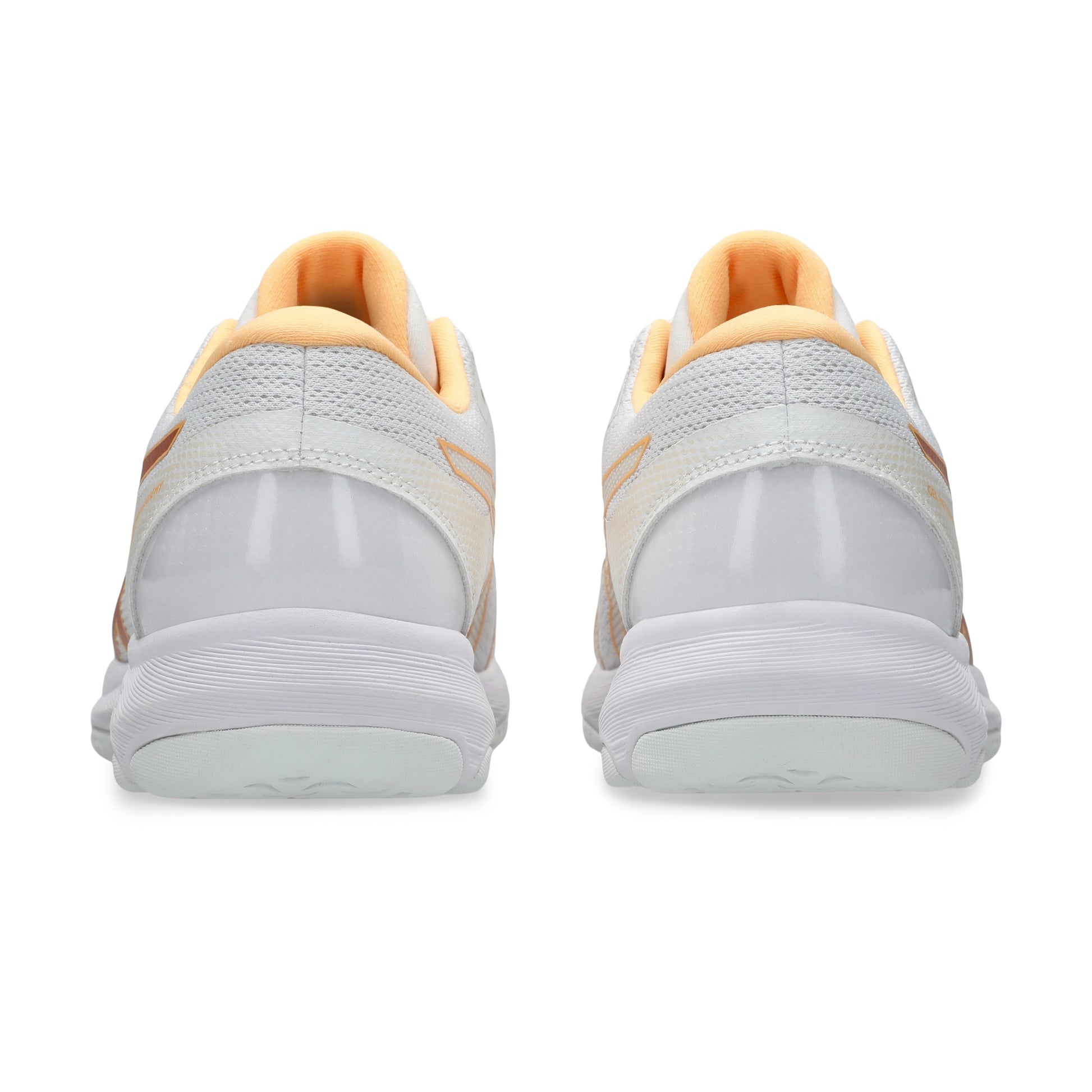A pair of white netball shoes shown from the back, featuring light peach-orange lining and subtle orange accents on the heel straps, set against a plain white background.
